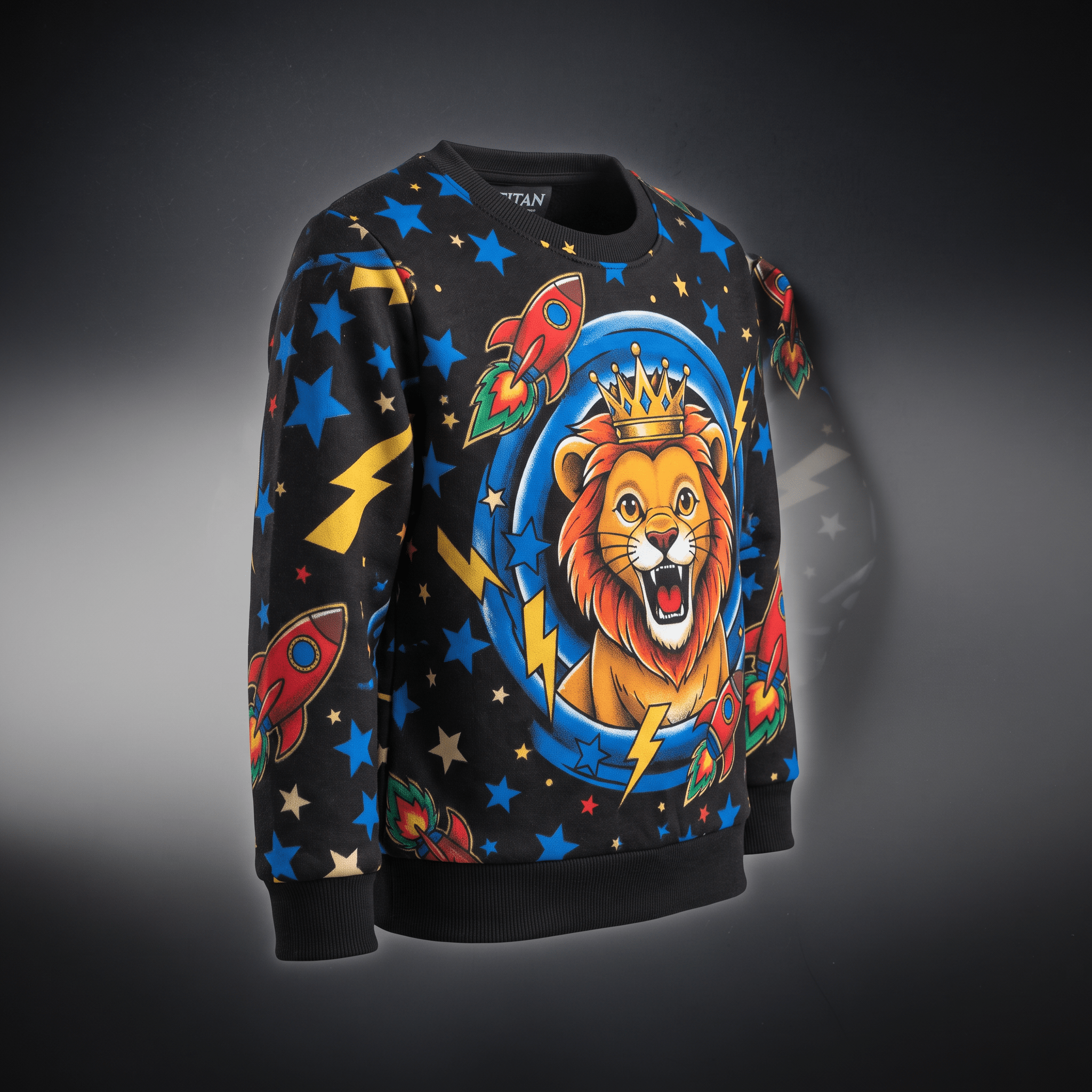 Black crewneck sweatshirt featuring a crowned lion, rockets, lightning bolts, and blue stars.