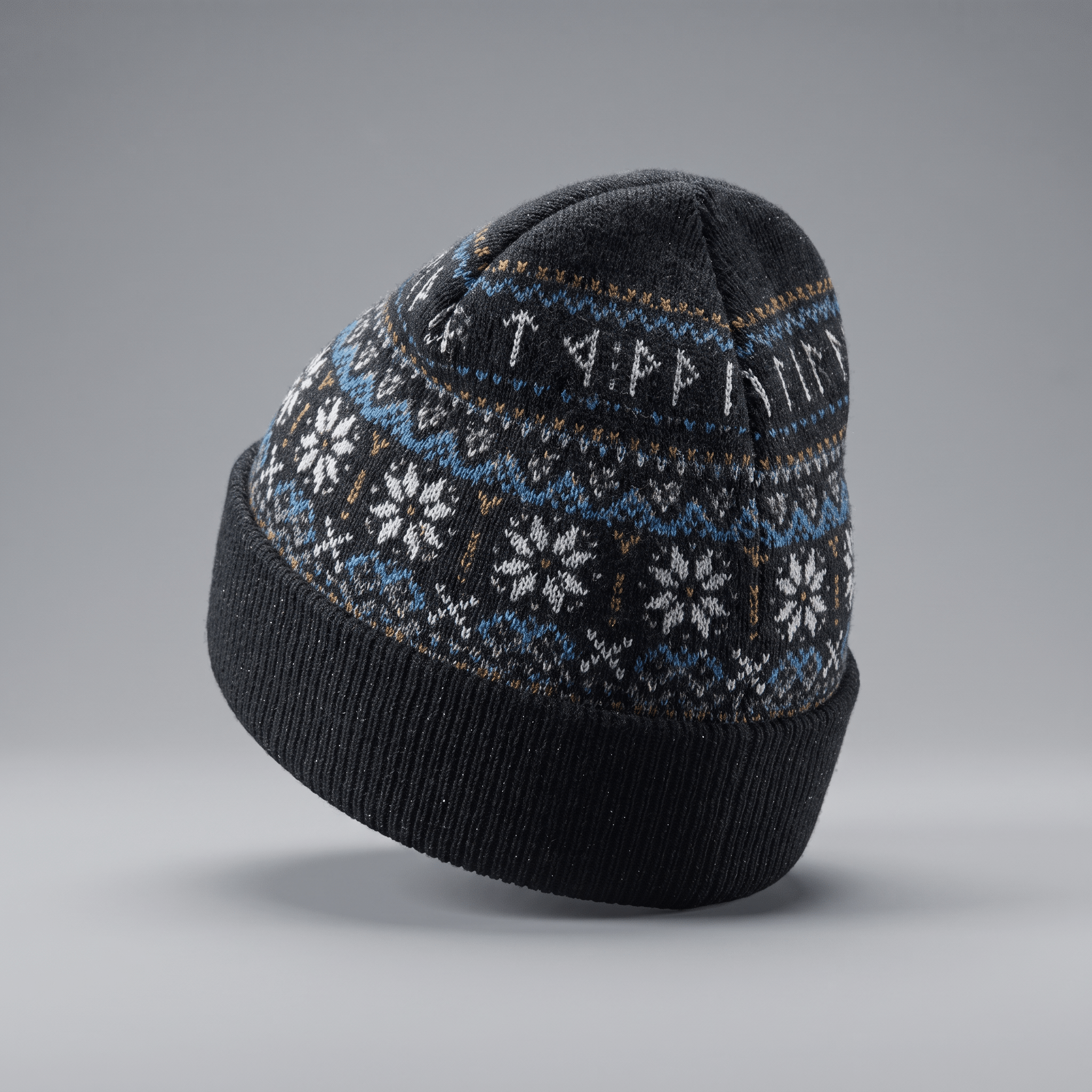 Dark grey knit beanie featuring a Nordic fair isle pattern with blue, white, and tan snowflakes and runes.
