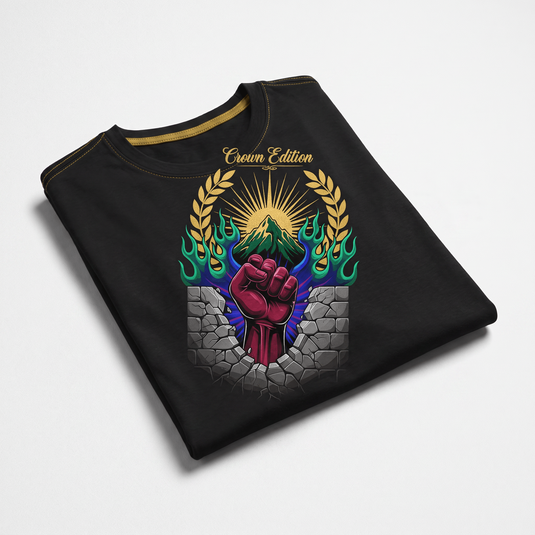 Folded black t-shirt featuring a graphic of a fist breaking through a wall with a mountain and flames.