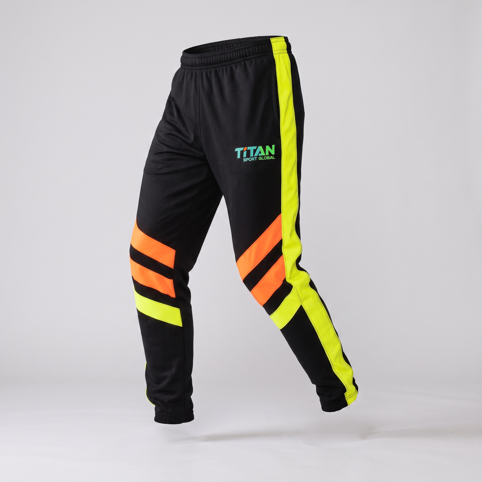 Black athletic track pants with neon yellow side stripes, orange knee stripes, and Titan Sport Global logo.