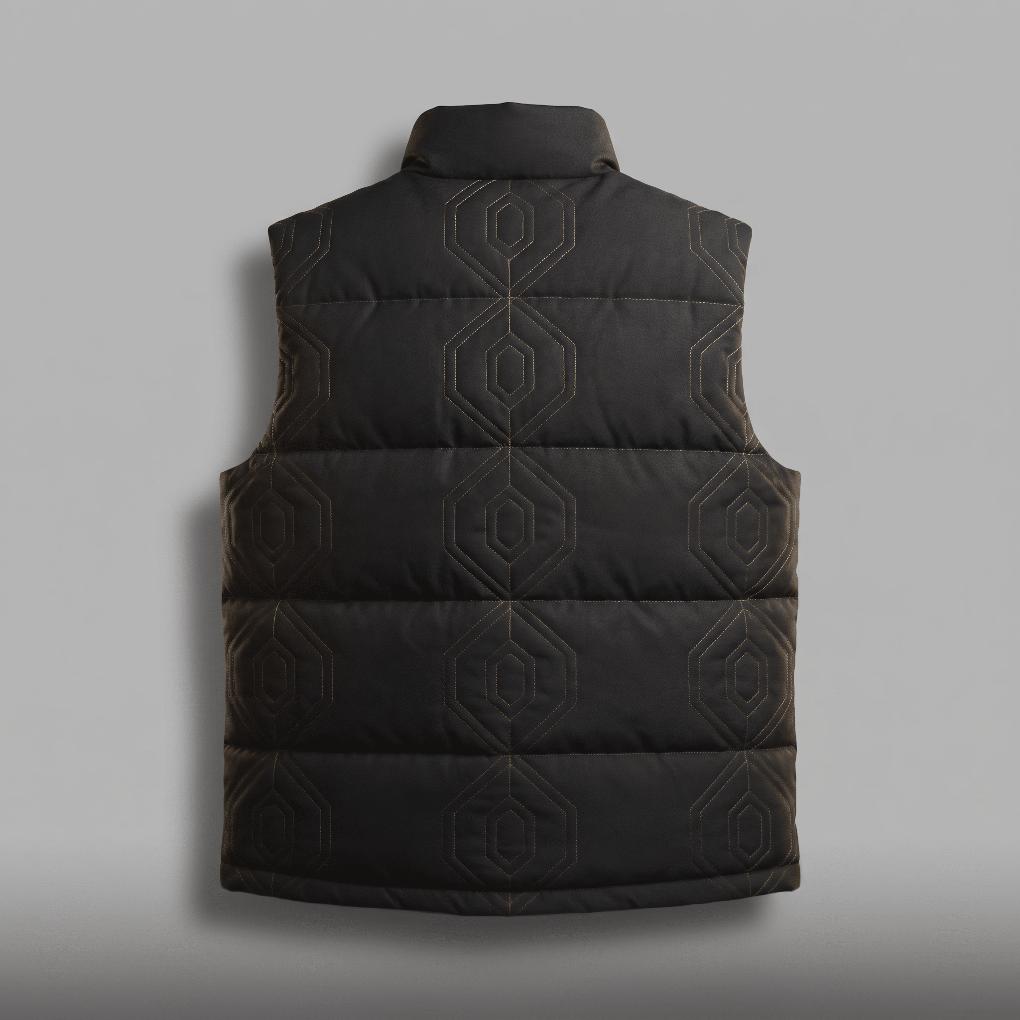 Back view of a black puffer vest with geometric hexagonal stitching on a grey background.