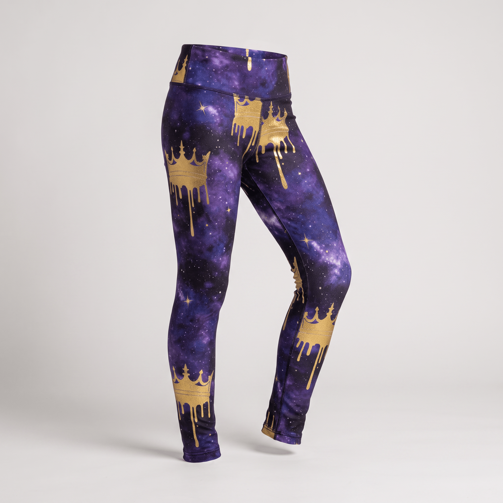 Purple galaxy print leggings featuring a gold melting crown pattern on a mannequin.