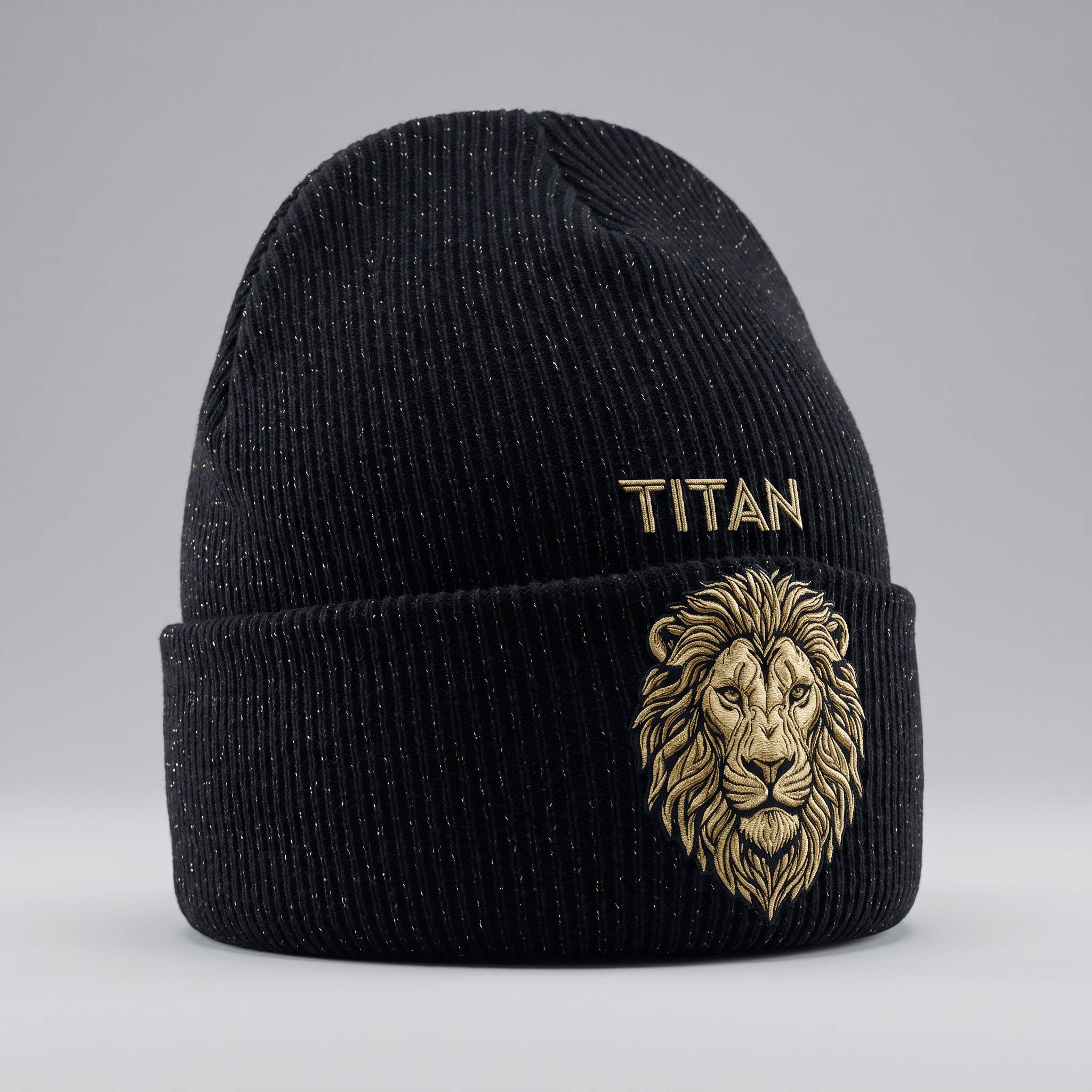 Black knit cuffed beanie with gold metallic thread, featuring embroidered lion head and Titan text.