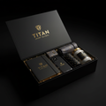 Black gift box with gold TITAN logo containing a leather journal, phone case, geometric accessories, and a glass jar.