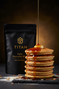 TITAN Keto Pancake Mix Almond Flour — dramatic syrup pour shot with tall golden pancake stack, maple syrup cascade and melting butter