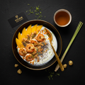 TITAN Thai Mango Coconut Shrimp Protein Bowl Breakfast flat lay dark luxury