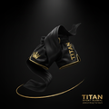 TITAN Muay Thai Shorts Blackout Gold — matte black satin with gold crown logo