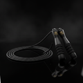 TITAN Speed Cable Skipping Rope Elite — matte black with gold crown logo