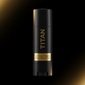 Matte black TITAN anti-chafe balm stick with gold lettering and branding on a dark, moody background.