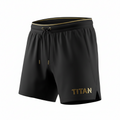 Black TITAN mesh training shorts with gold waistband trim, matching gold-tipped drawstring, and gold logo detail.