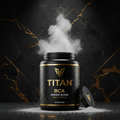 Titan BCAA black tub with gold lettering and white powder erupting against a dark, gold-veined marble background.