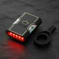 TITAN Crown Edition cycling rear light in matte black with gold logo, iridescent accents, and glowing red LEDs.