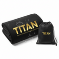 Black microfiber gym towel with gold TITAN logo and features text, paired with a matching black mesh carry pouch.