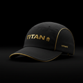 Black lightweight running cap with gold accents, metallic "TITAN" logo, and side mesh panels on a black background.