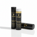 Three black TITAN Sport Balm tubes with gold branding, water droplets, and white cap against a white background.