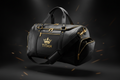 Black TITAN luxury gym bag with gold zippers, hardware, and a prominent gold crown logo on a dark background.