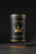Black canister with gold Greek key trim, crown logo, and Titan Magnesium Complex text on a dark background.