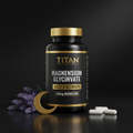 TITAN Magnesium Glycinate bottle in black and gold with lavender sprigs, a gold crescent moon, and white capsules.