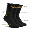 Three black TITAN performance crew socks with gold logo, labeled with features like cushioned sole and arch support.