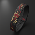 Black silicone watch band with red crown icon and gold geometric lightning patterns, featuring TITAN logo loop.