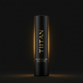 Matte black TITAN SPF 50 lip balm tube with gold vertical text and glowing light effects against a dark background.