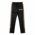 Black TITAN track pants with gold side stripes, drawcord waist, metallic leg zips, and gold "TITAN" thigh logo.