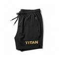 Black TITAN 7-inch training shorts with elastic drawstring waist, gold zipper pocket, and gold metallic logo.