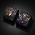 TITAN Crown Edition wristbands with intricate, vibrant lion and eagle designs featuring gold crowns on a black background.